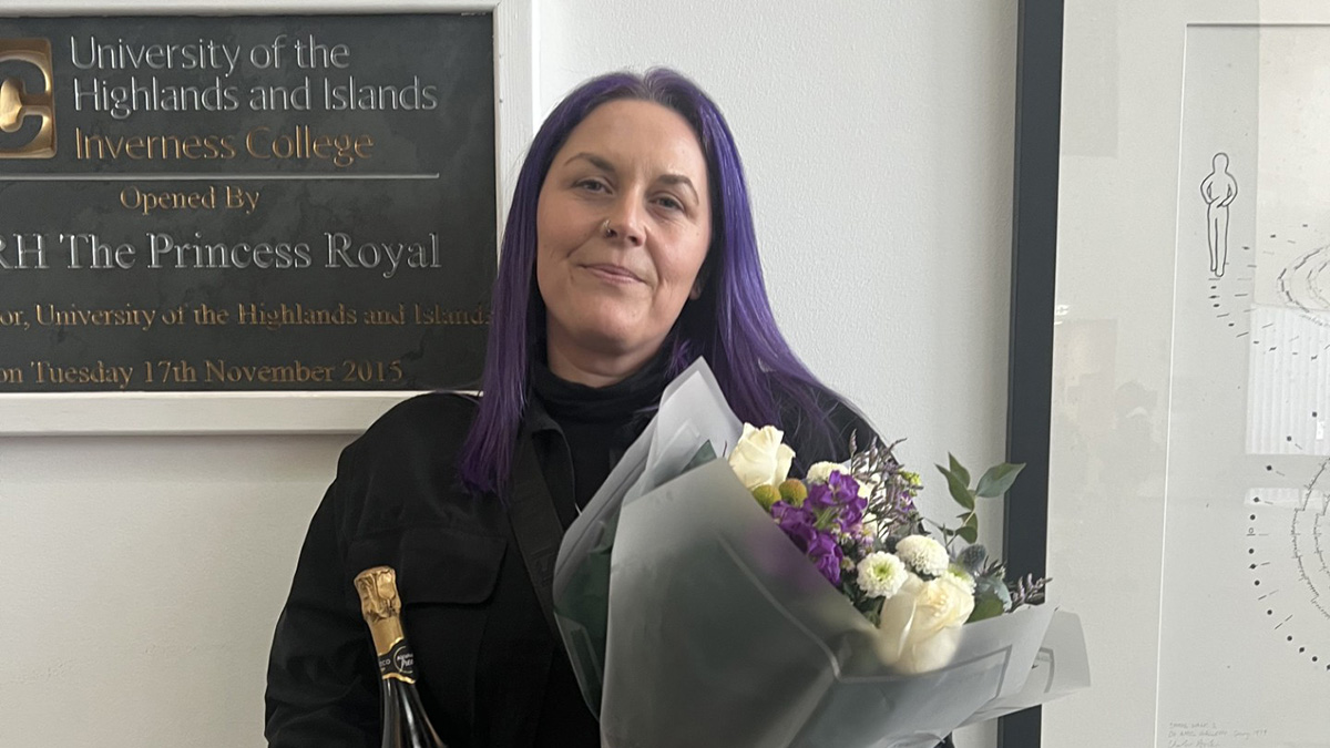 Student Nadine Murray with flowers Student Nadine Murray with flowers