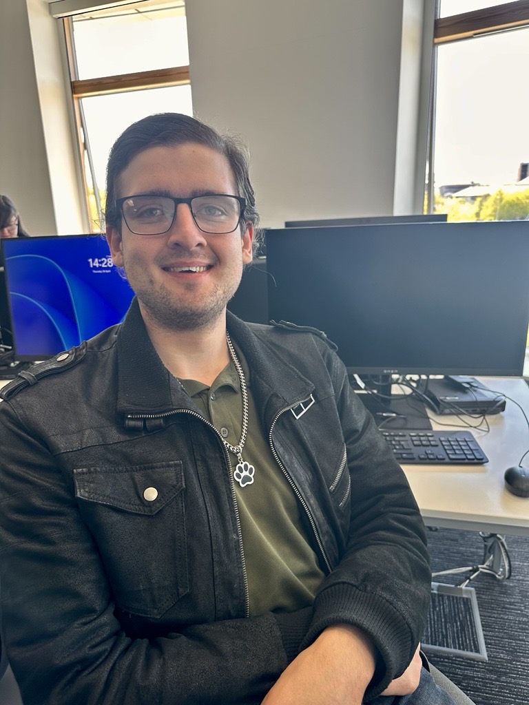 student sitting in front of a computer screen