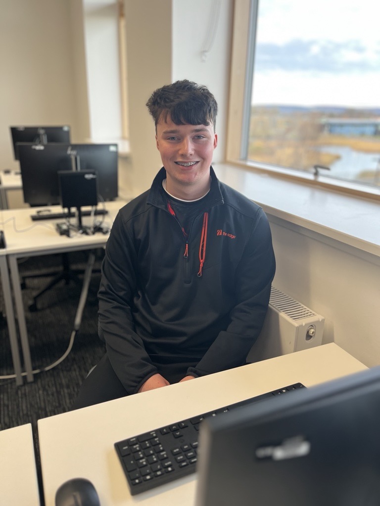 Student sitting at a desk Student sitting at a desk