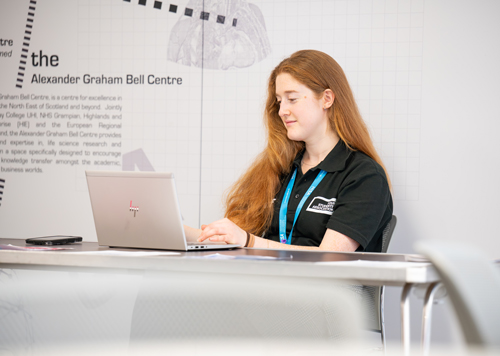 student working on a laptop