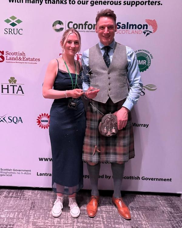 Ailie Macleod holding ALBAS award with Lecturer David Olds at the awards ceremony Ailie Macleod holding ALBAS award with Lecturer David Olds at the awards ceremony