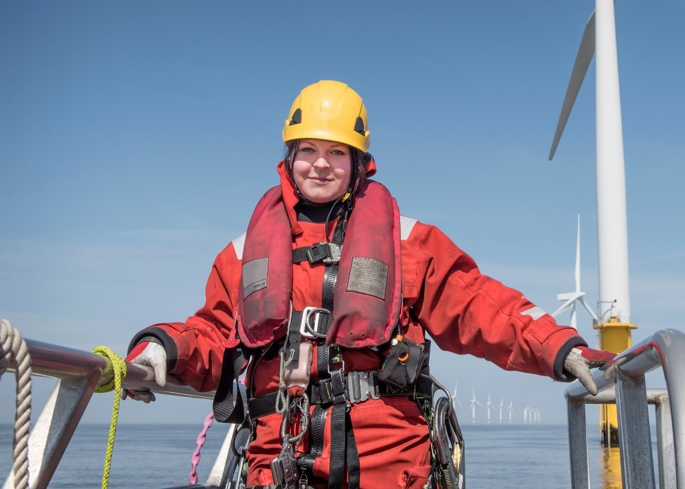 Person at an offshore wind farm in PPE