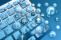 A keyboard with bubbles of digital icons in front of it A keyboard with bubbles of digital icons in front of it