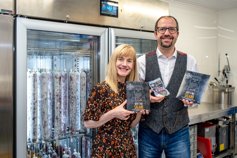 Two people posed with an award