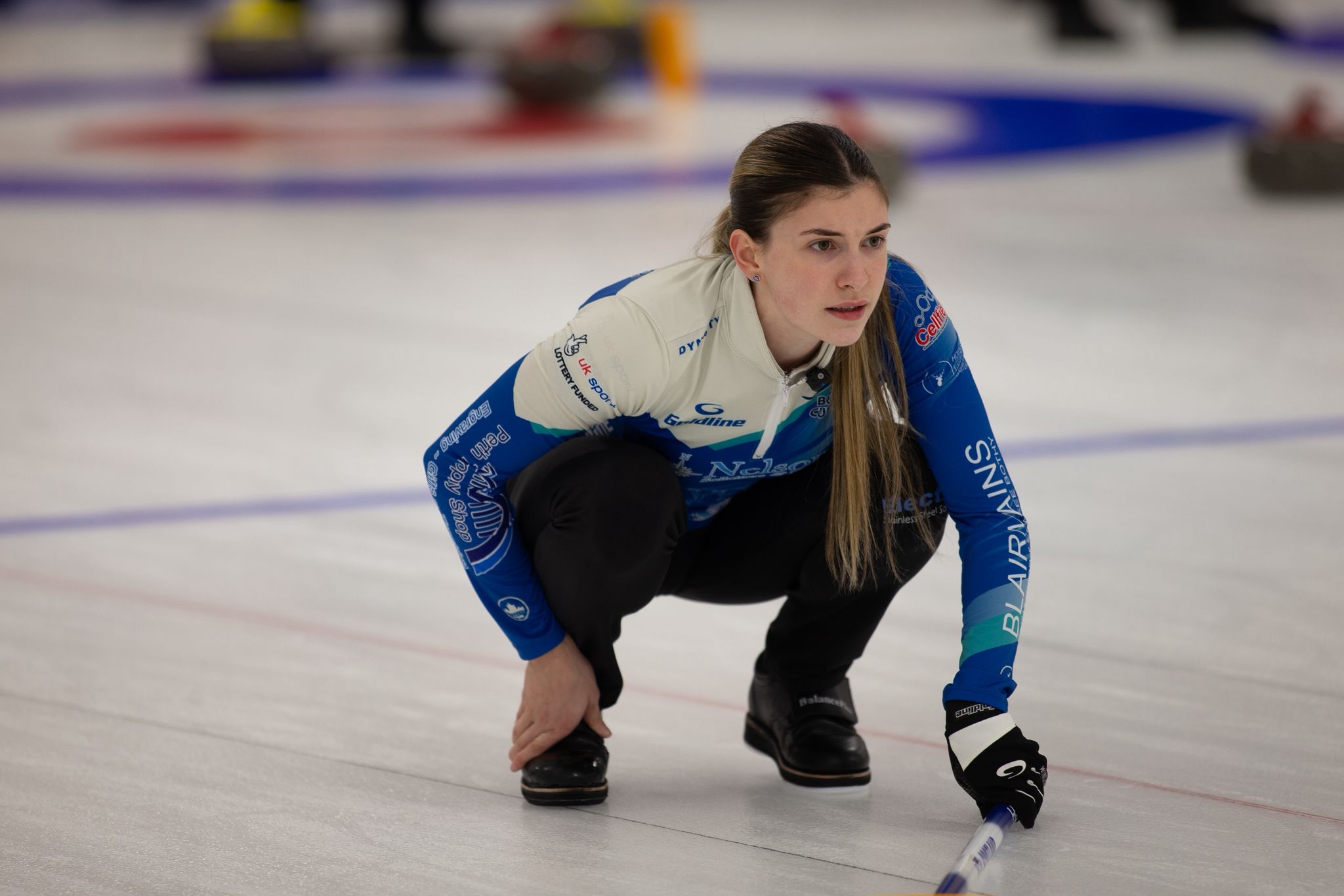 Laura Watt, a sports therapy student at UHI Perth, curling on an ice rink Laura Watt, a sports therapy student at UHI Perth, curling on an ice rink