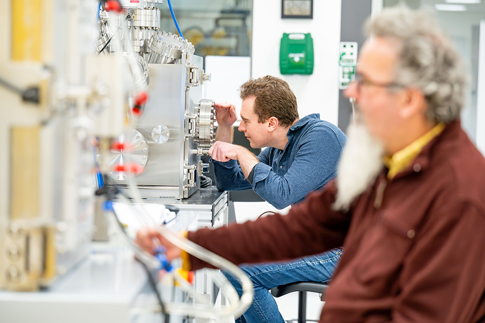 Scientists using lab equipment