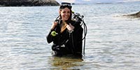 diver waist deep in the sea