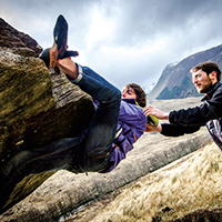 Two people rock climbing Two people rock climbing