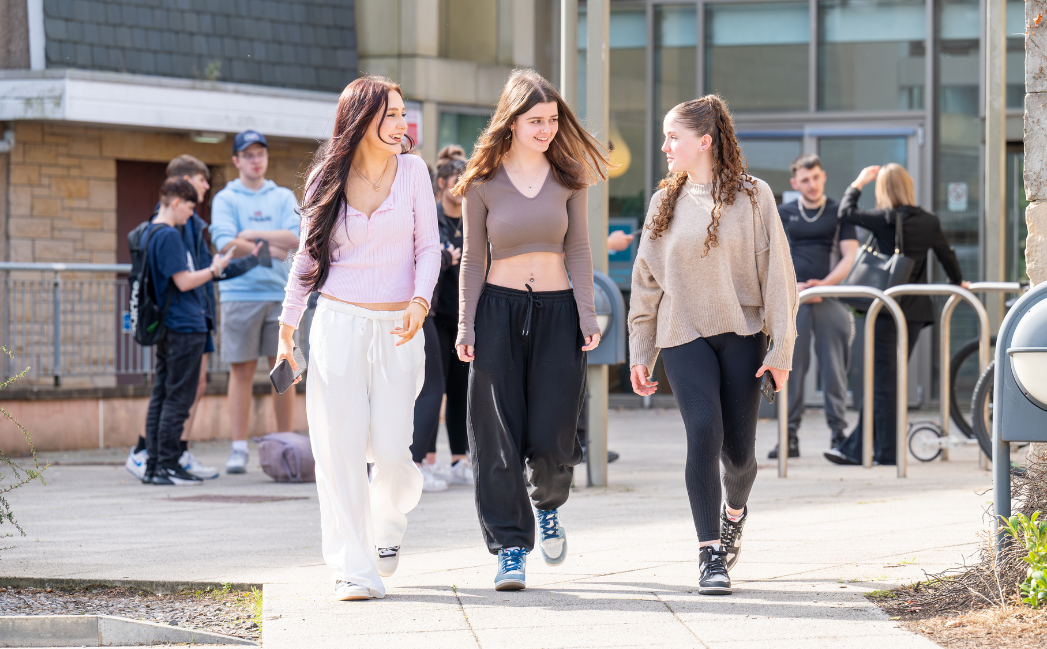 Students walking outside a campus Students walking outside a campus