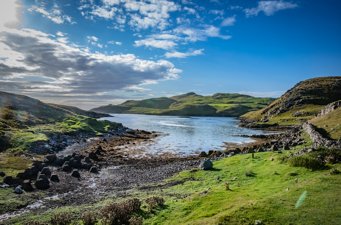 Green hills and a bay on the Shetland islands Green hills and a bay on the Shetland islands
